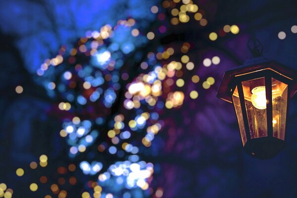 Christmas garlands on the background of a lantern