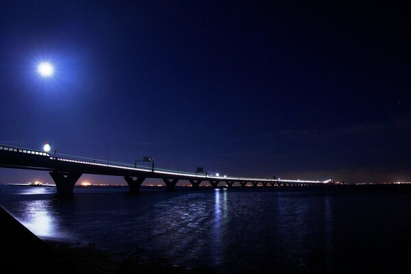 Night lights of the city, reflected light from the bridge