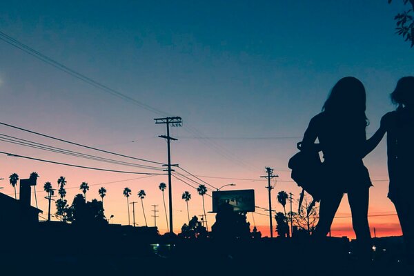 Silhouette of girls against the sunset