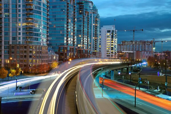 A road among lights and houses