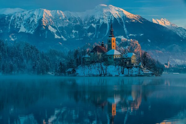 Castle in the mountains on the lake shore