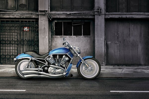 Blue motorcycle near an abandoned building