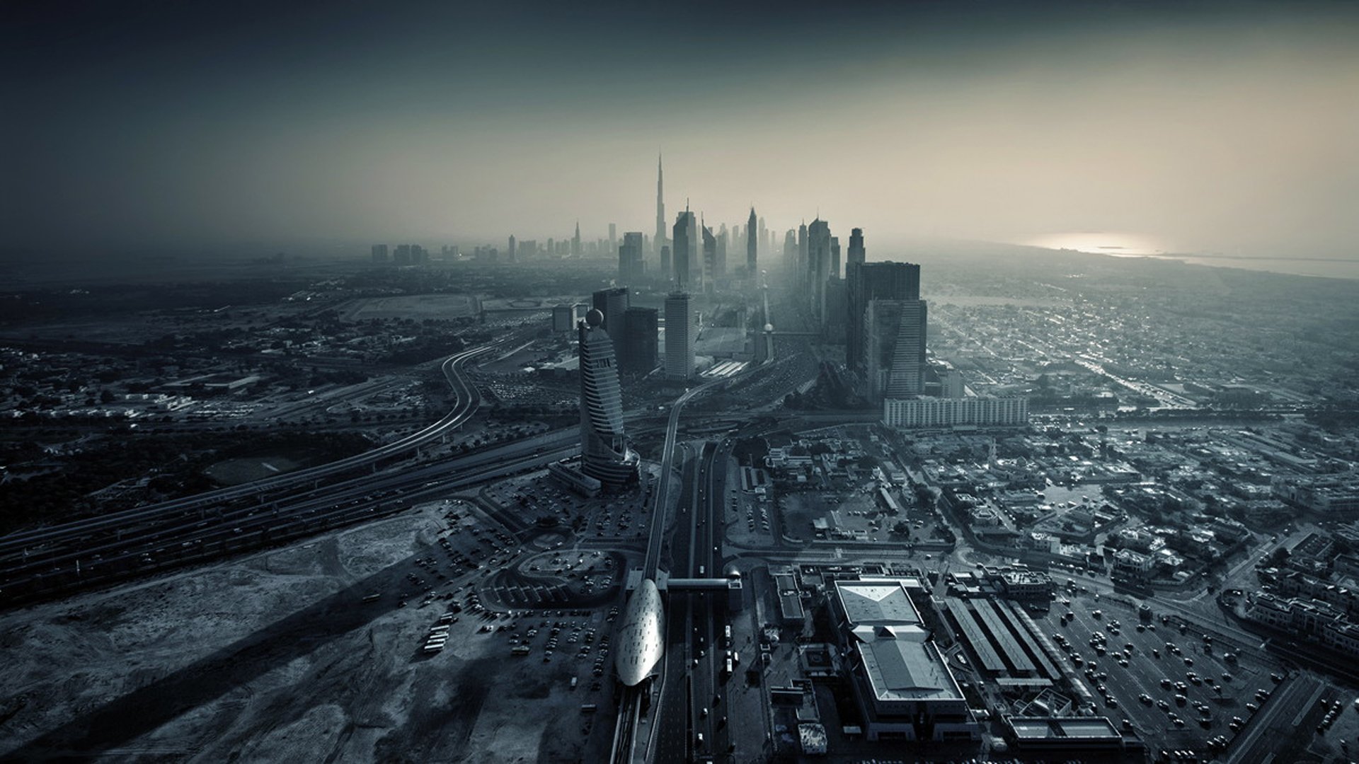 dubaï ville coucher de soleil eau emirats arabes unis métropole gratte-ciel bâtiments routes