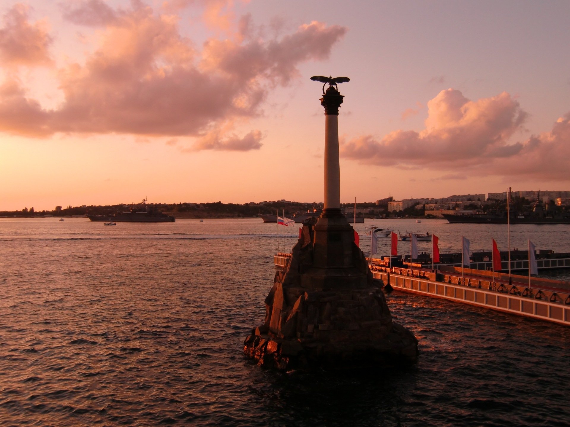 evastopol town hero water monument of sunken ships embankment sunset night clouds russia