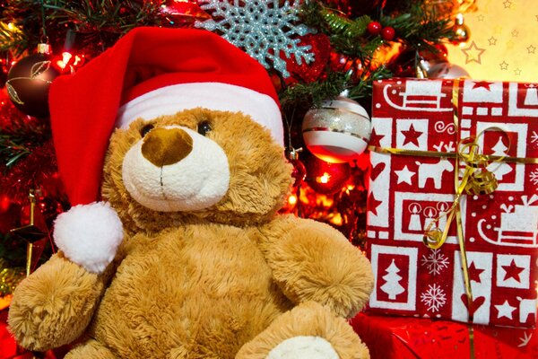 Christmas bear in the image of Santa Claus