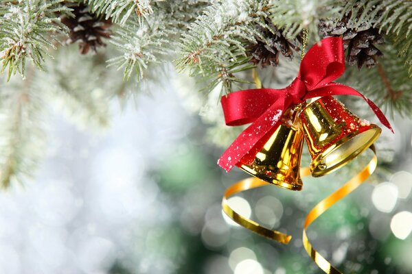 Golden bells with a red bow