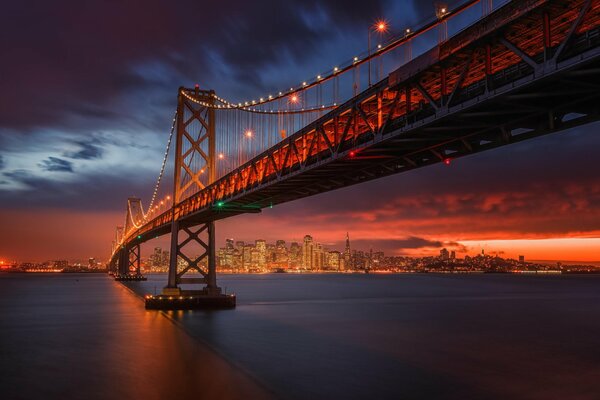 Ocean, bridge, city in the distance