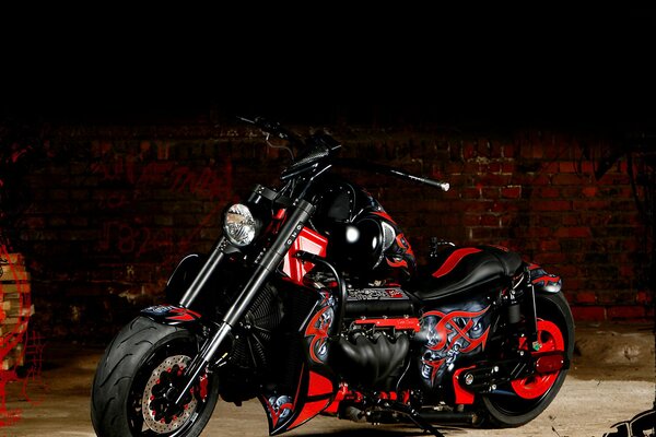 Red motorcycle on a brick wall background