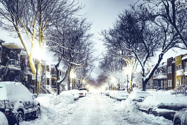 Winter street lit by lanterns