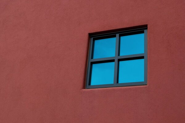 Black window on a red wall (minimalism)