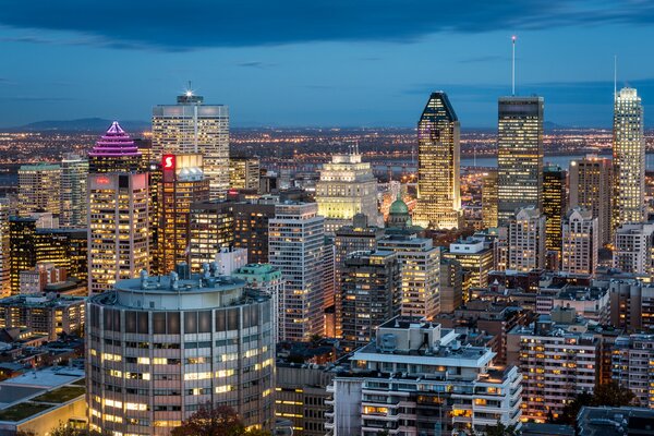The night city in Montreal is surrounded by its skyscrapers