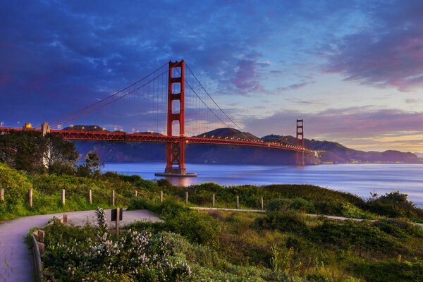 Golden Gate Bridge in San Francisco, at high tide, in blue and lilac tones