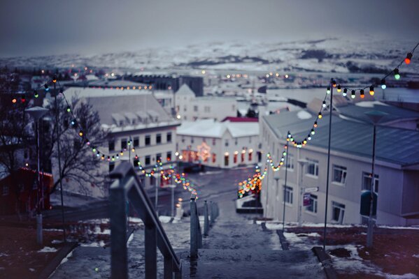 Christmas city in the photo in the style of bokeh