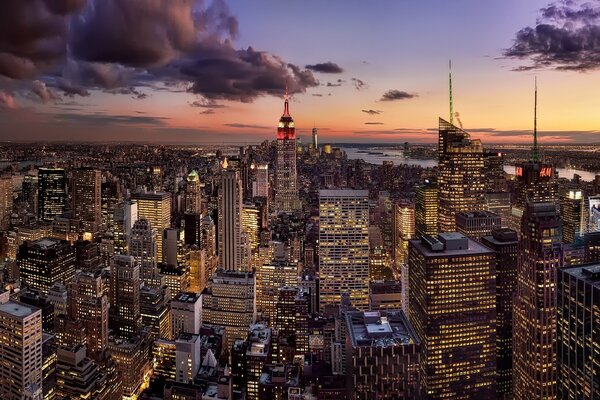 A huge, sparkling metropolis under the evening sky