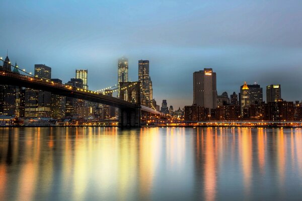 Evening view of New York skyscrapers and Brooklyn Bridge