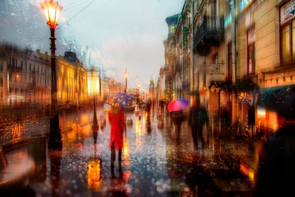 Passers-by with umbrellas in a rainy city