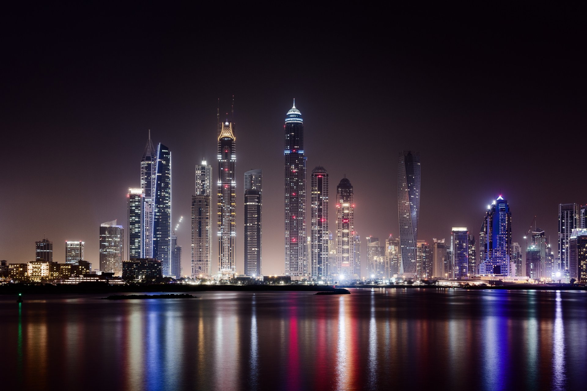 united arab emirates uae dubai city metropolis skyscrapers houses buildings night lighting lights water light