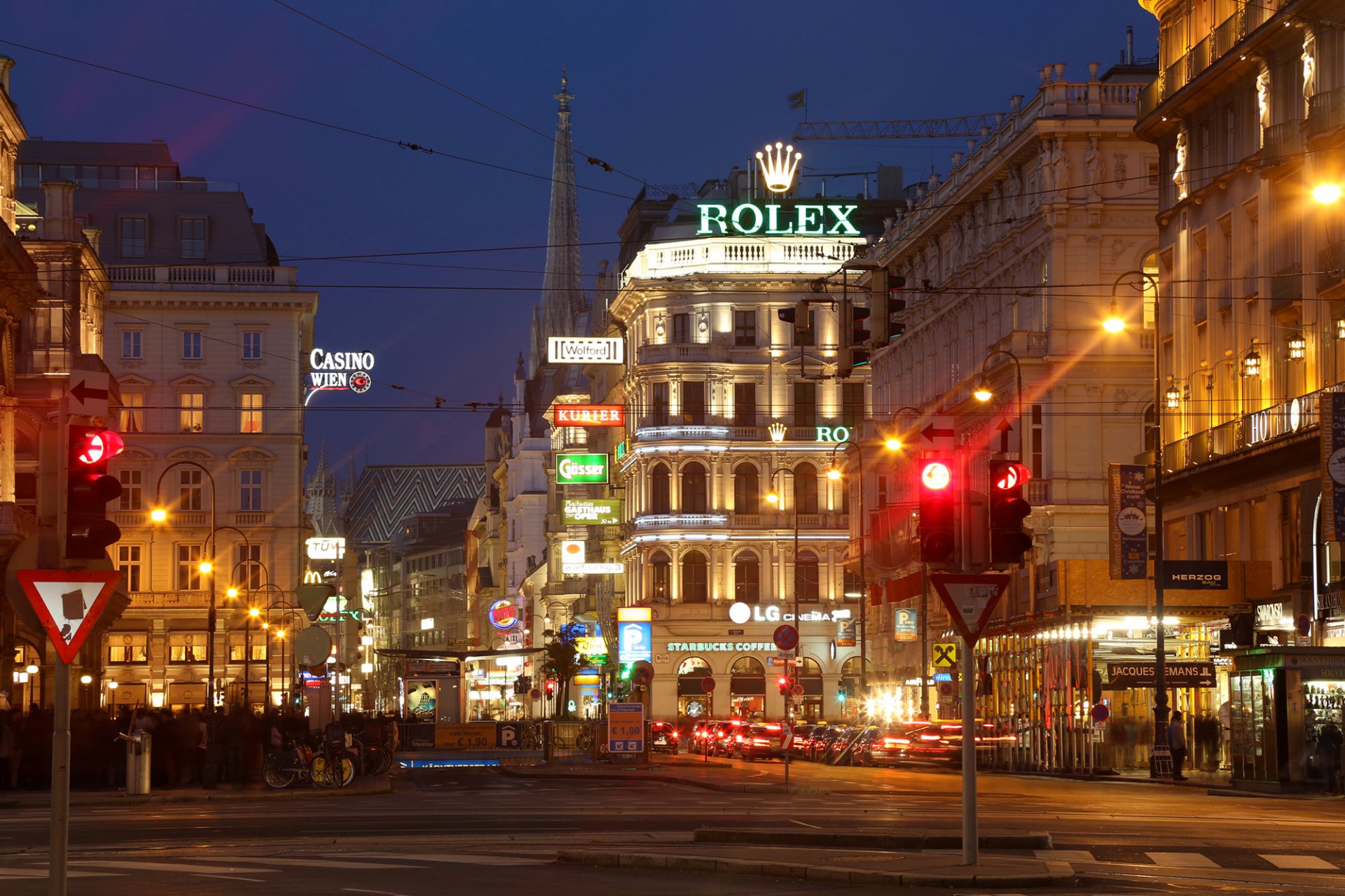 vienna austria kerntnerstrasse city night street lights road traffic light buildings shops cafe