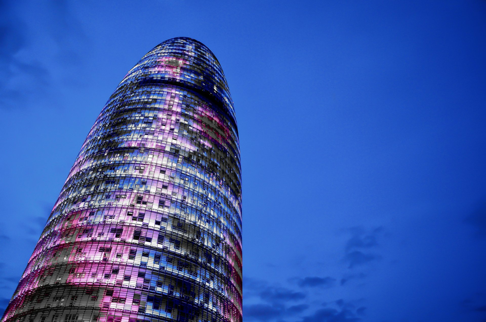 pain catalonia barcelona torre agbar tower skyscraper architecture construction night blue sky cloud