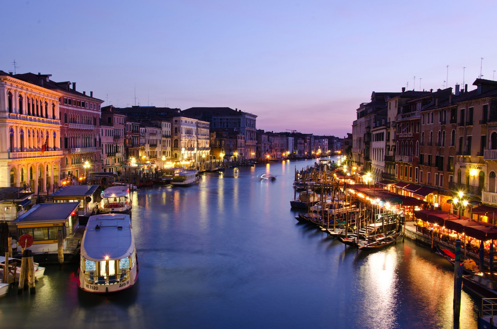 italy venice canal grande grand canal city evening twilight houses buildings sea gondolas boats lighting lights lantern