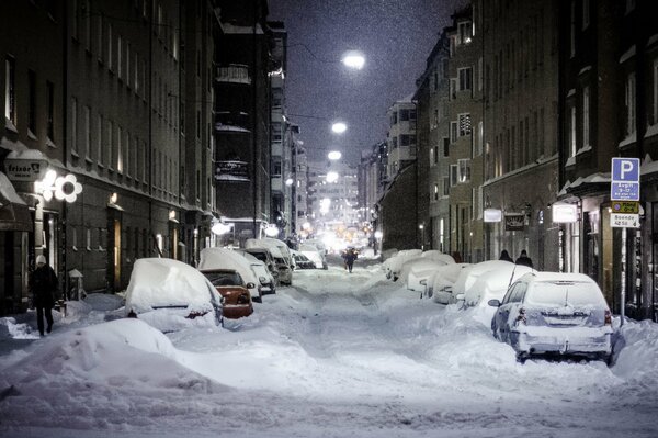 Snowy street with lanterns