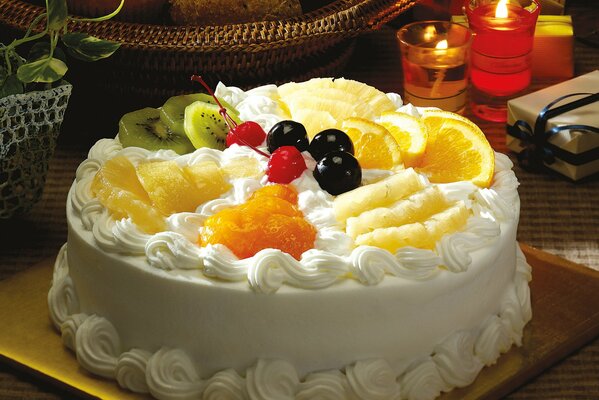 Delicious cake with whipped cream and fruit