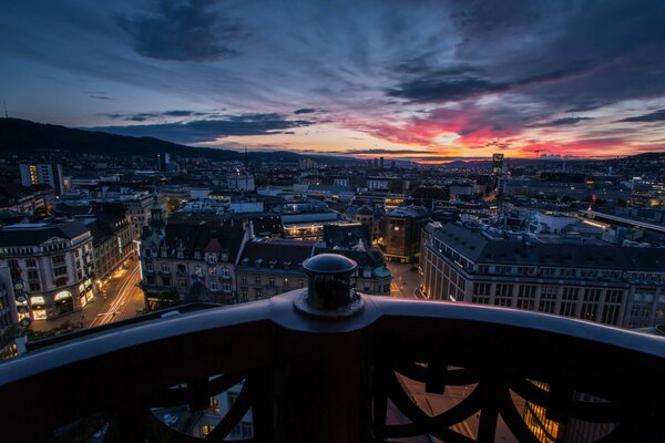 View from the balcony of the evening city with sunset