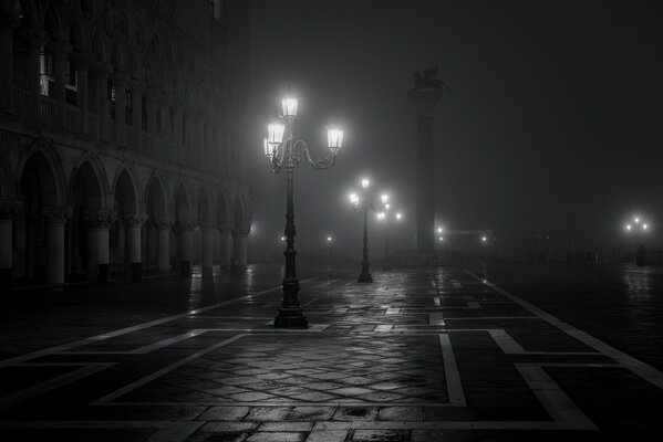A black and white street in the fog of San Marco Square