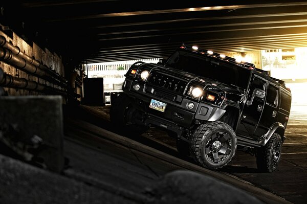 Black Hummer SUV overcomes obstacles