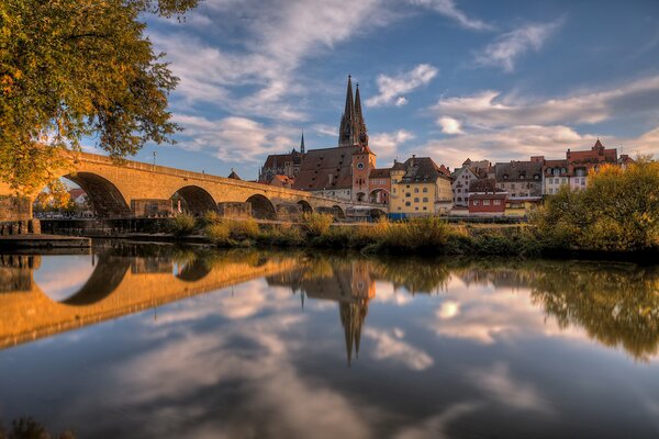 Reflection in the lake of the castle with clouds