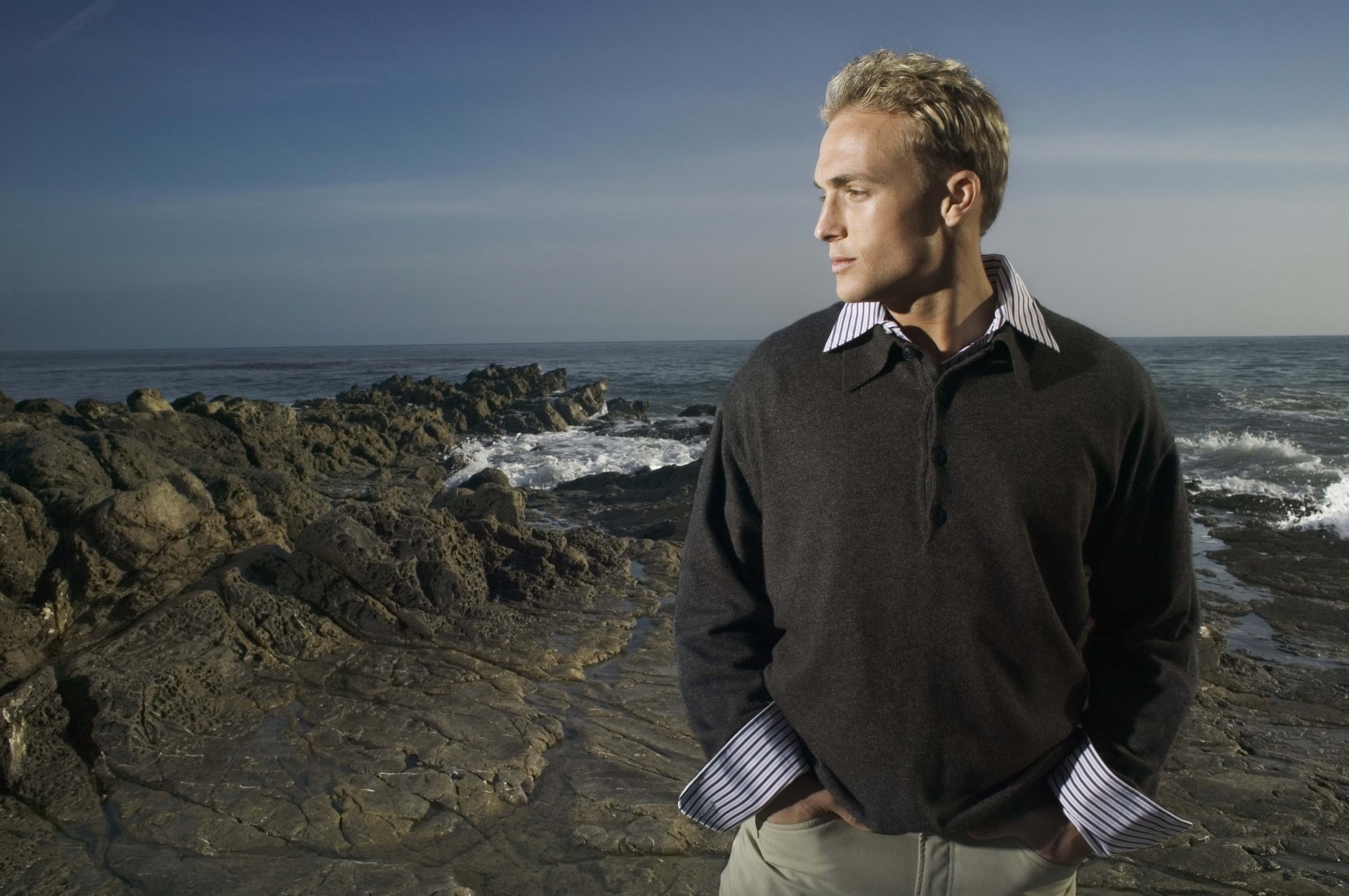 blonde man night sea clothing rock