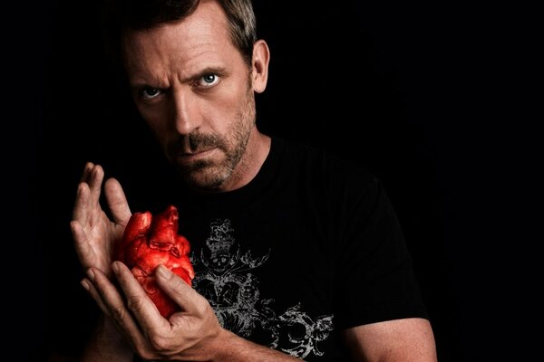 Hugh Laurie holds his heart in his palms