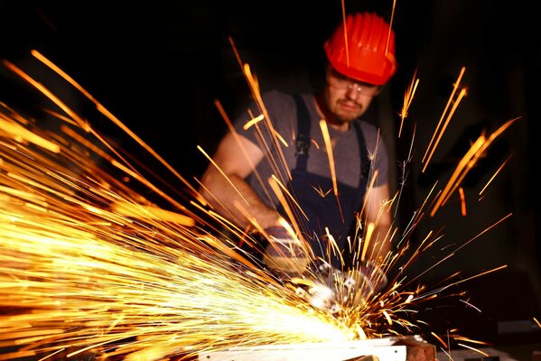 Cutting with a grinder sparks fly