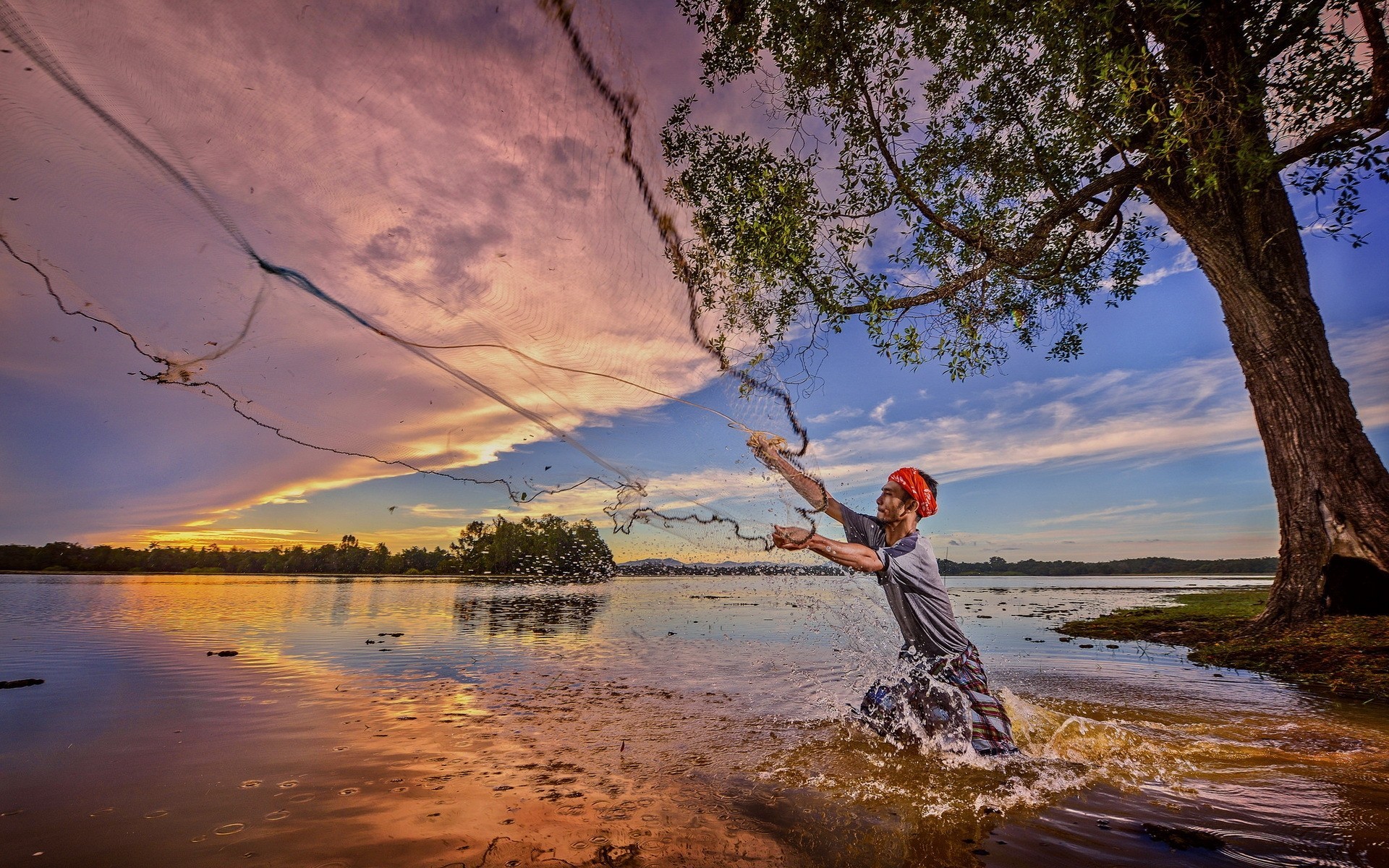 puesta de sol pescador río red