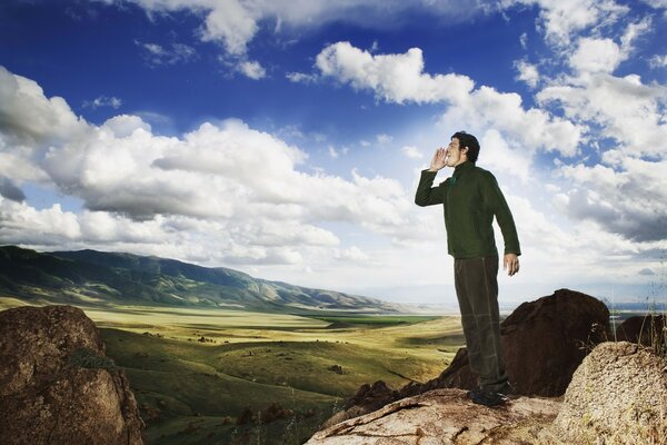 A man screams in the mountains