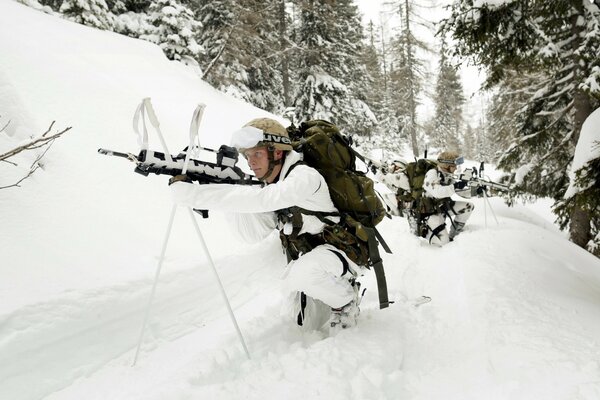 Army of soldiers with weapons in the snow