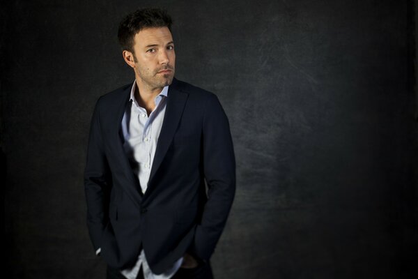 Actor Ben Affleck poses in an open-necked shirt