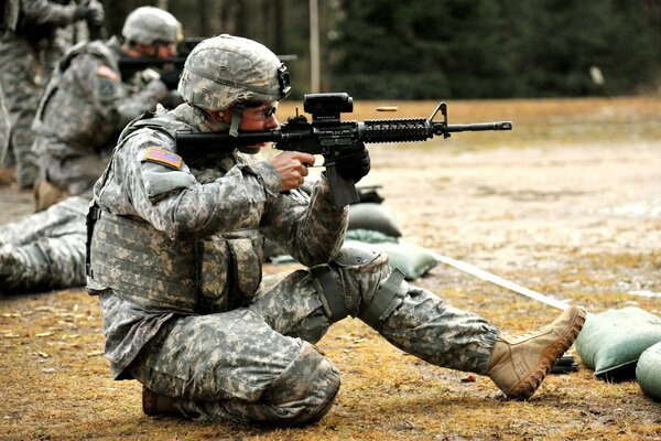 Soldiers in camouflage at the shooting range