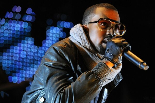 Kanye West on stage. Singer with microphone