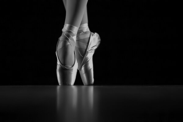Pointe shoes of a ballerina in a dance