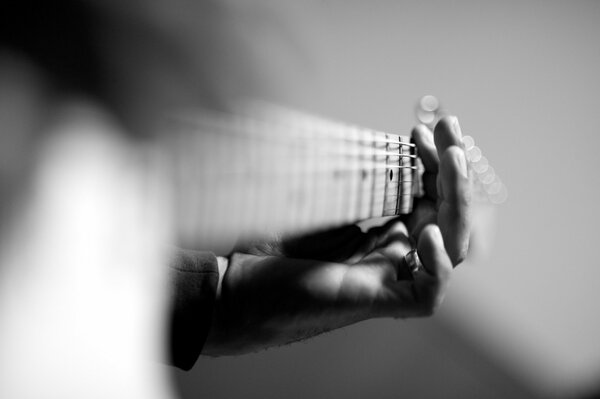 Black and white photo of guitar playing