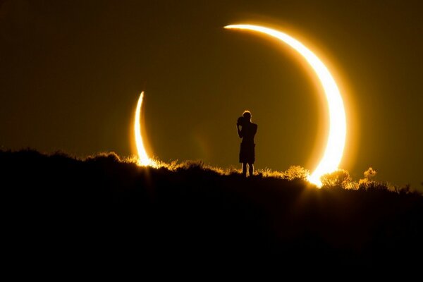 Silhouette against the background of a solar eclipse