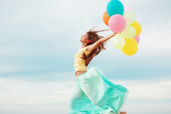 Girl in a skirt with balloons