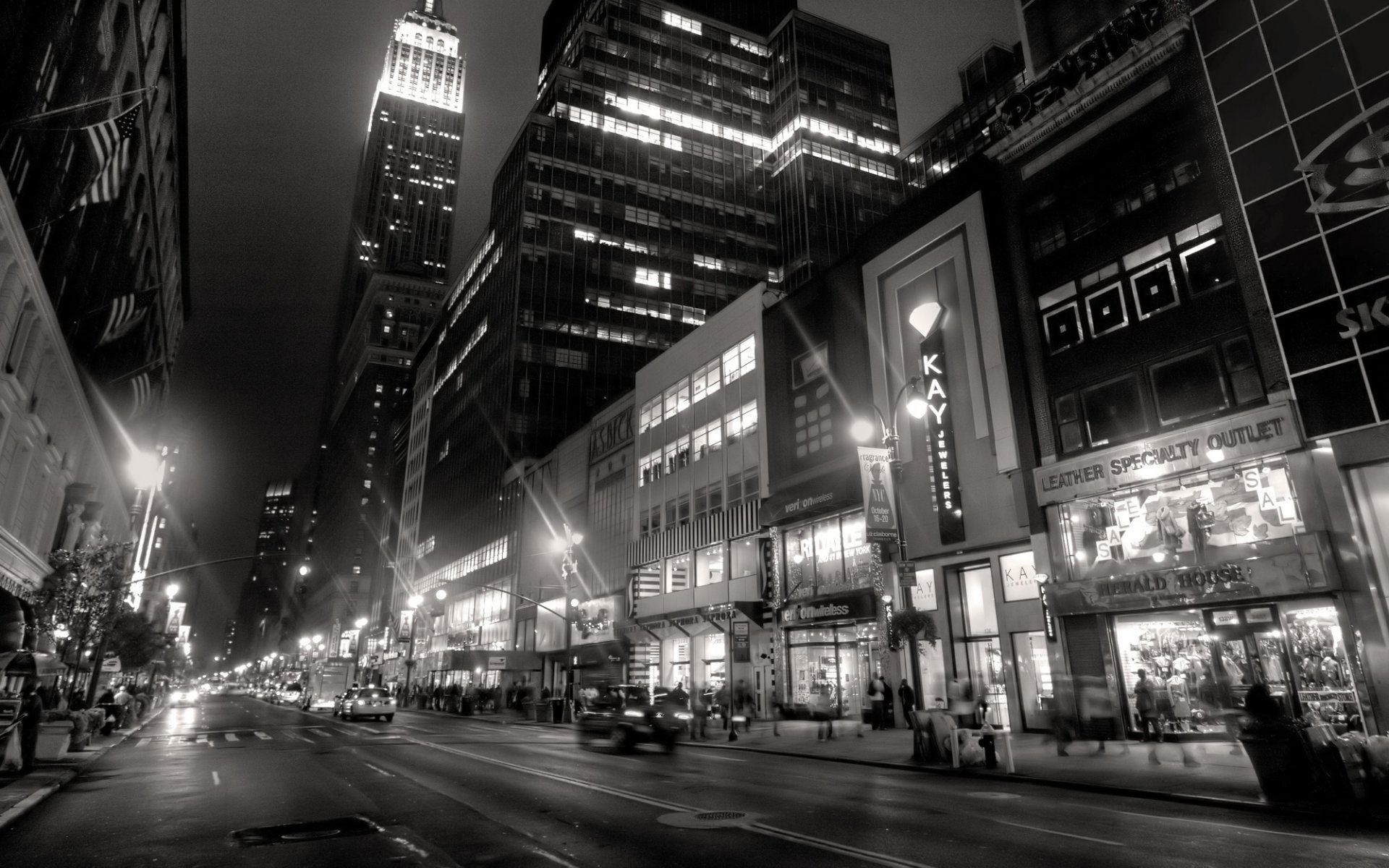 new york city night lanterns man black and white lights buildings people taxi black and white