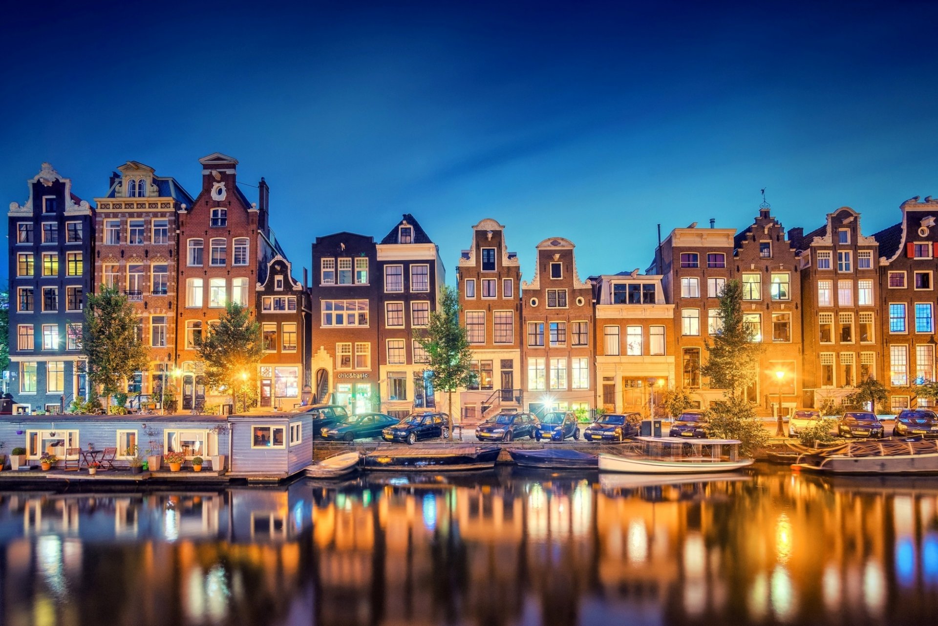 amsterdam nord-holland holland niederlande stadt abend kanal lichter reflexion licht boote fluss häuser gebäude