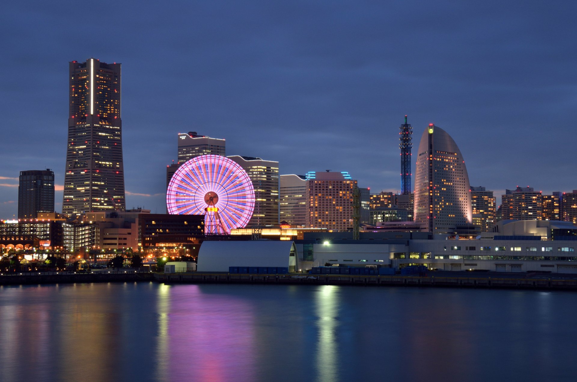 japan yokohama yokohama megapolis buildings houses ferris wheel night blue sky sunset lights lighting backlight bay reflection