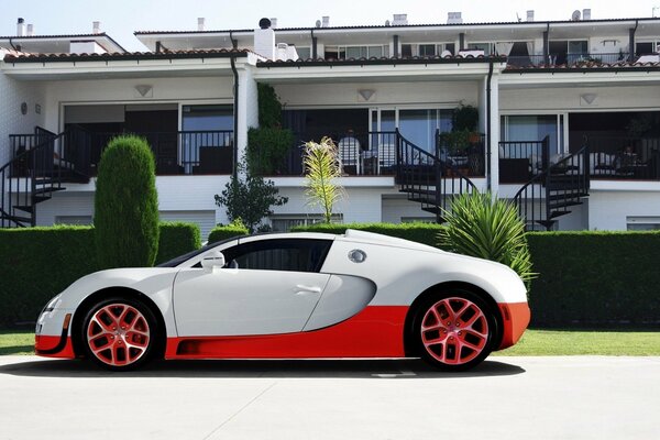 Sports car on the background of an expensive house