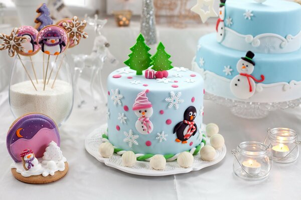 Cakes and pastries decorated with Christmas trees, snowmen, snowflakes. Burning candles in glass jars