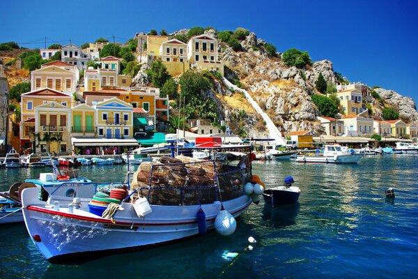 Greece. Houses in the mountains and boats in the sea