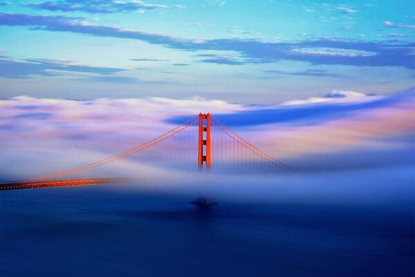 The big bridge behind clouds and fog